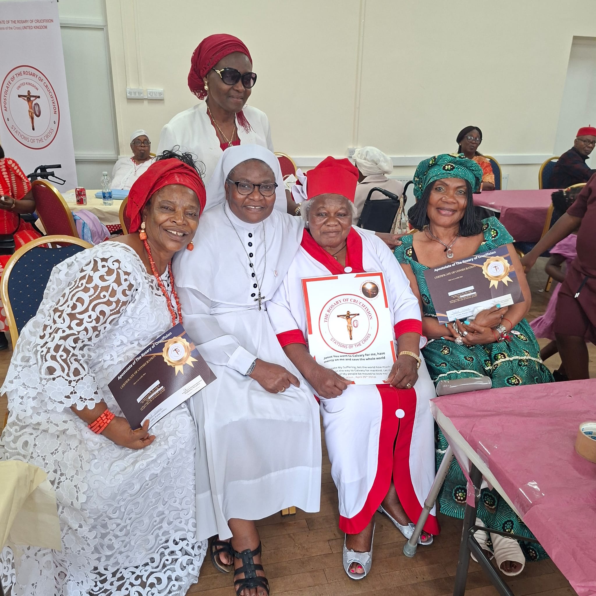 Devotees and sisters holding consecration certificates in Walthamstow London